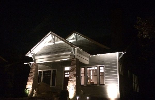 Craftsman custom home exterior illuminated at night