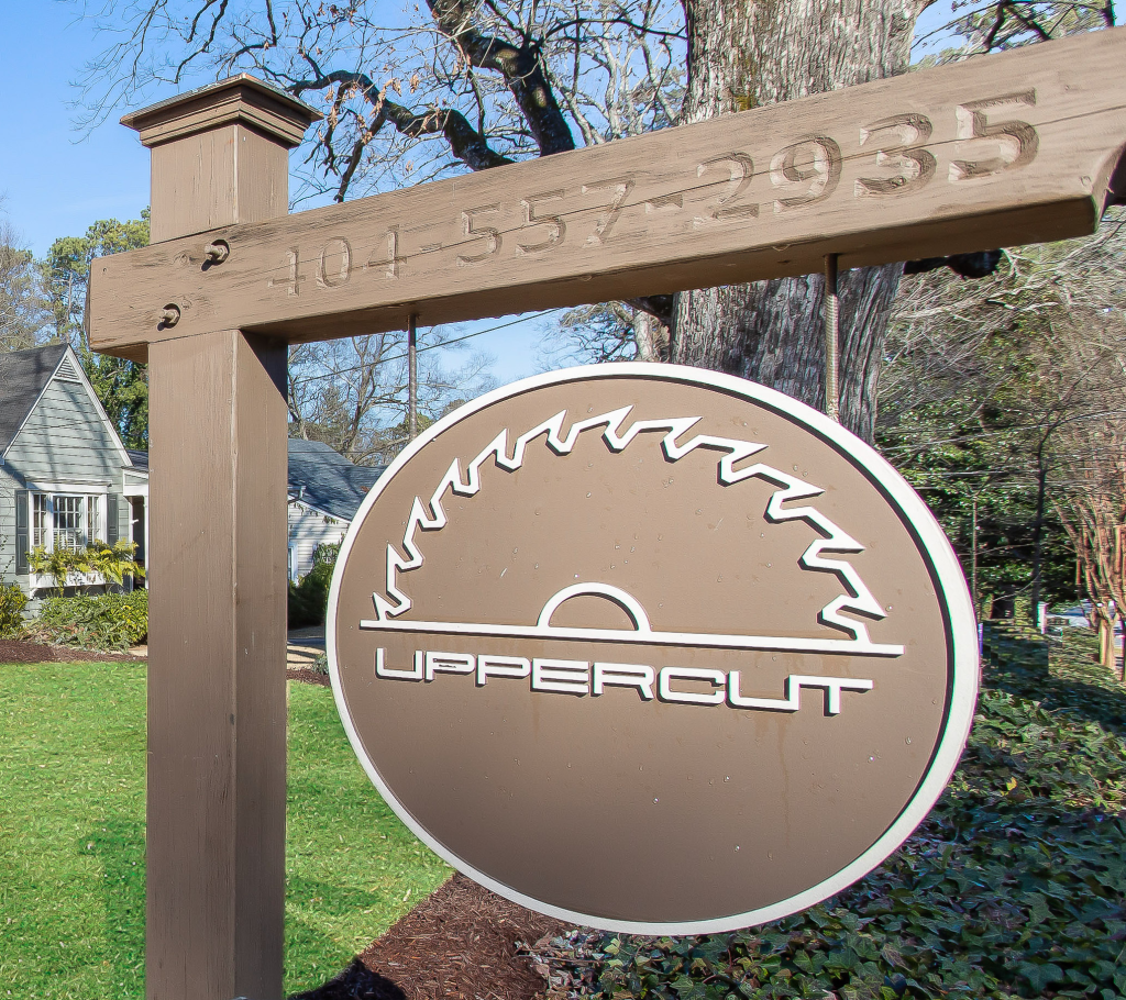 Uppercut Homes yard sign with company logo and phone number outside a Marietta, GA home
